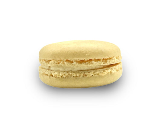 Side profile of salted caramel French macaron