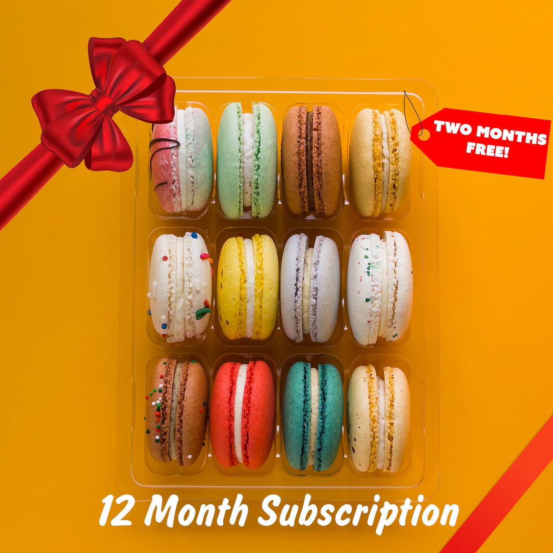 Box of colorful macarons with a red bow on an orange background, featuring text about a subscription offer.