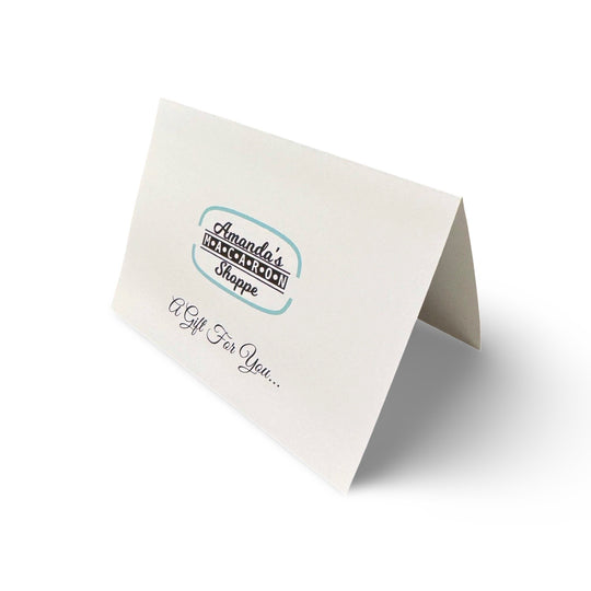 a note card which has a logo and "a gift for you" written on the front