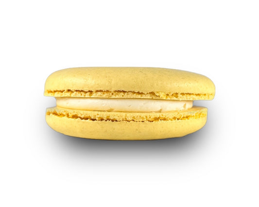 A single yellow macaron with a visible creamy filling, isolated on a white background.