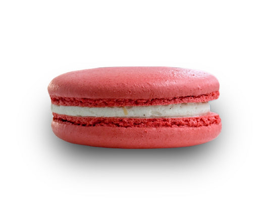 Red macaron with white filling on a white background