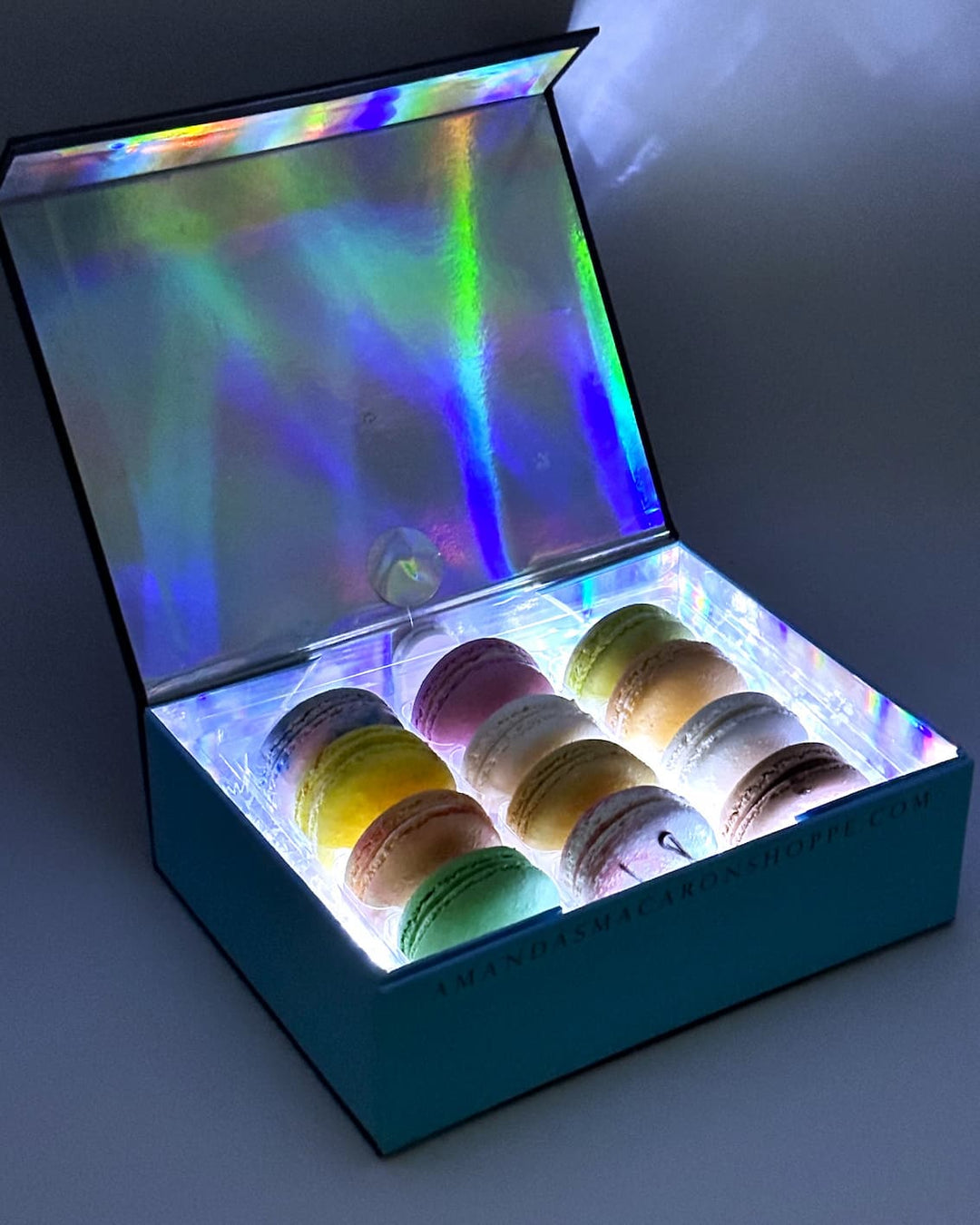 a light up white gift box of french macarons